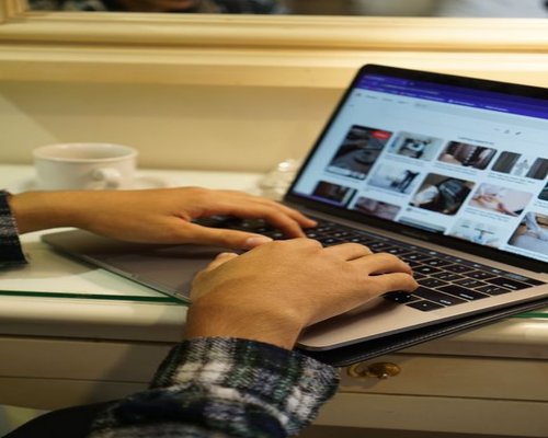 person working on a laptop at home in Indonesia